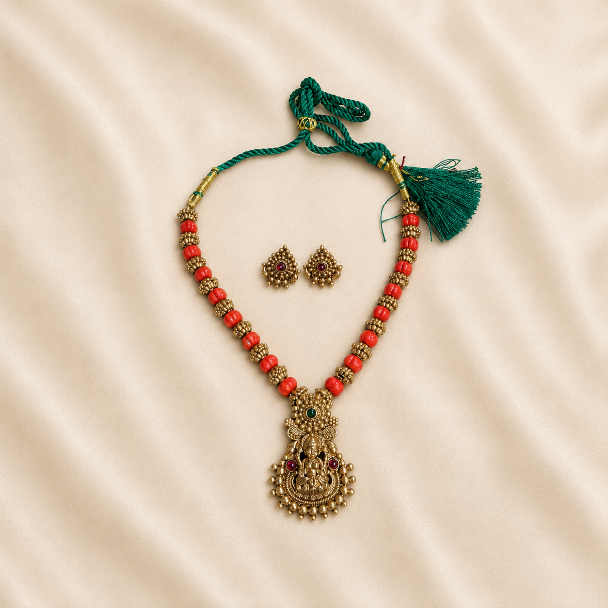 Coral beads with laksmi pendant